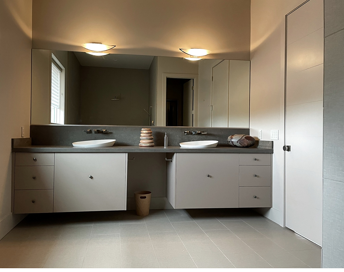Blush floating double vanity photographed with the lights on
