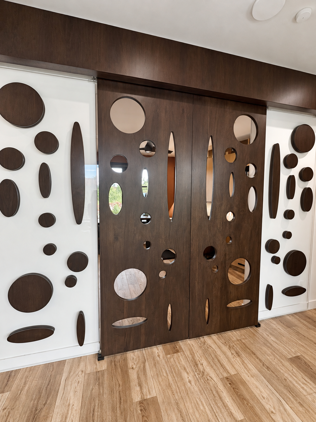 Four-panel circular door and wall installation by Burkee Designs